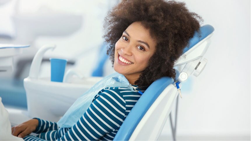 Woman Smiling In a Dental Chair